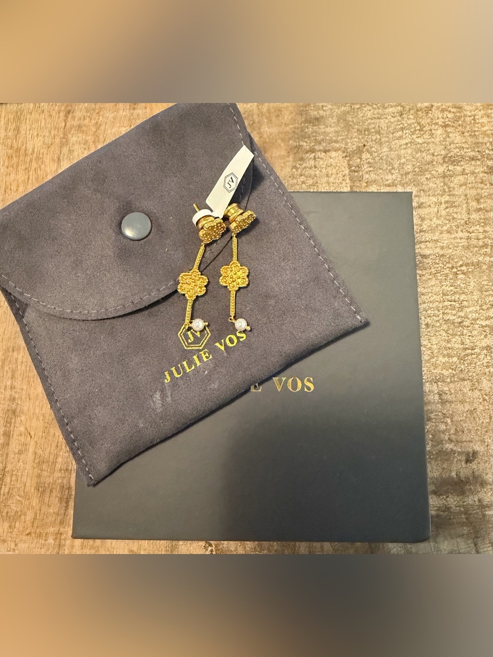 Julie Vos earrings feature a gold clover design with small pearl details. NWT